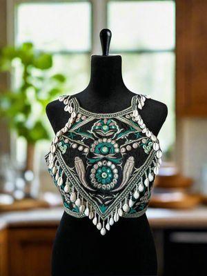 Handcrafted festival crop top featuring embroidery, shell tassels, and mirror work. Tribal-inspired design perfect for burning man, music fe