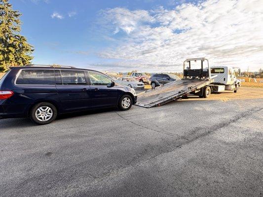 Tow truck loading van