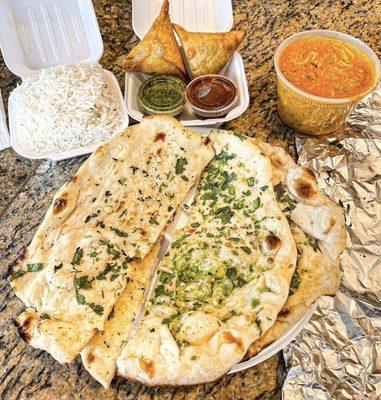 Garlic Naan, Chicken Makhani (Butter Chicken), Chicken Samosas (2), Steamed Basmati Rice
