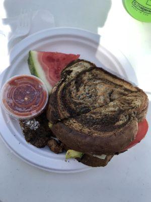 Grilled feta, parm, avo, spinach, tomato, and jerk chicken on rye.