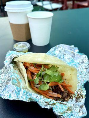 Vegan brisket taco with coffee