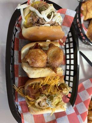 The flight with the jalapeño popper dog, El Jefe dog, and the King Dog