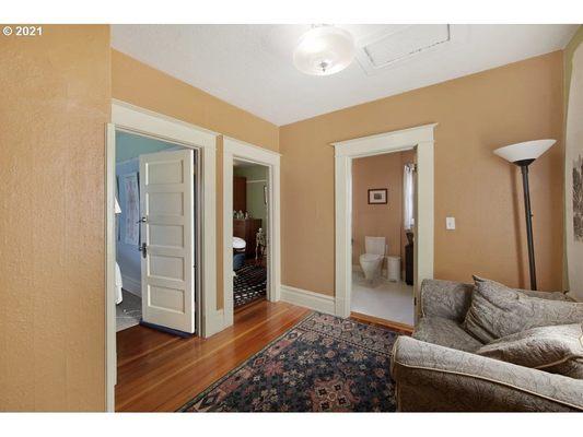 Upstairs lobby for acupuncture and massage therapy treatment rooms with private, gender-neutral restroom