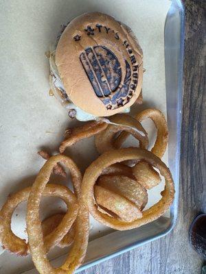 Black and blue burger and onion rings