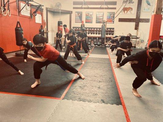 Dragon form has many iterations.  Our youth students learn it to build strong legs with deep stances.