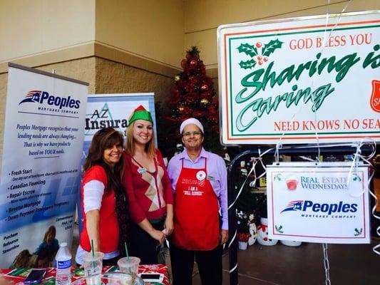Charlotte, our owner, volunteering, ringing a bell for the Salvation Army during the holidays.
