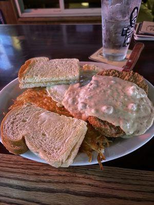 Chicken fried steak, hashbrowns, 3 eggs and sour dough bread.