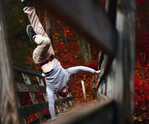 Co/Owner Justin Carney performing moves drawn from break-dancing out in the New England foilage