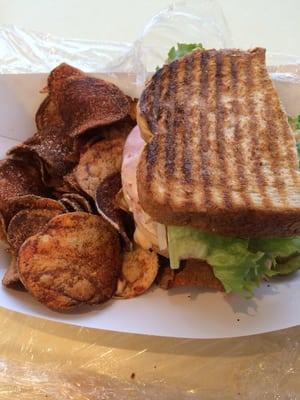 Sandwich with very over cooked homemade potato chips.