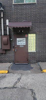 Salon Entrance in rear of building