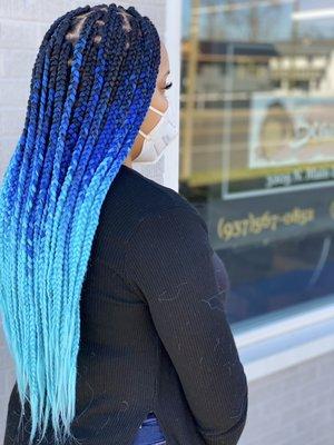 Large Box Braids using square parts with a dark root ombré hair.