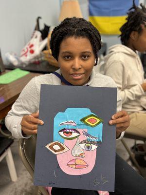 Student creating a portrait based on the style of Picasso