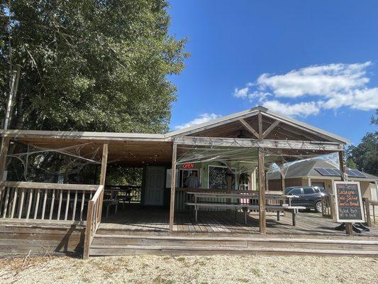 Small open patio with 3 long picnic tables for eating. Daily specials posted. Friendly staff.