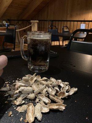 Complimentary peanuts in the shell and their own brewed beer