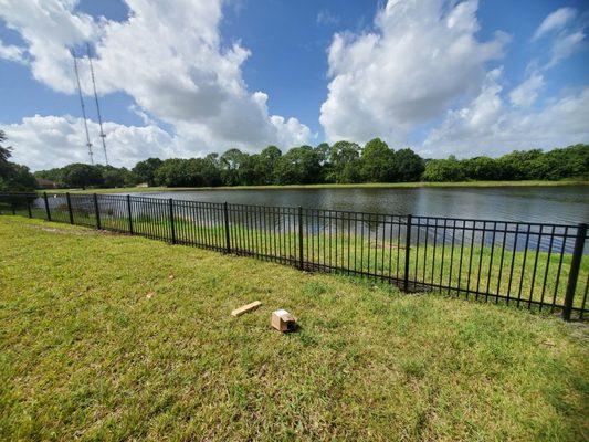 Four foot high, three rail, aluminum fence to keep pets safe.