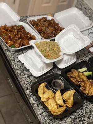General, orange, sesame chicken with fried rice , teriyaki chicken wings and dumplings. Everything 10/10