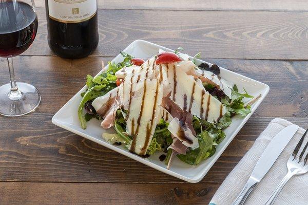 Positano salad with a Chianti glass.