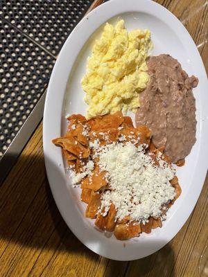 Breakfast plate with chilaquiles beans and eggs
