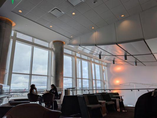 Sitting inside the upstairs loft at the Delta Sky Club in Concourse F at Hartsfield-Jackson Atlanta International Airport (ATL).