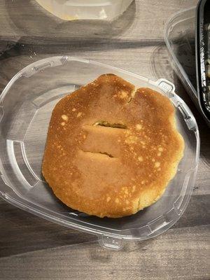 Same hard pancake with marks in it on the opposite side.