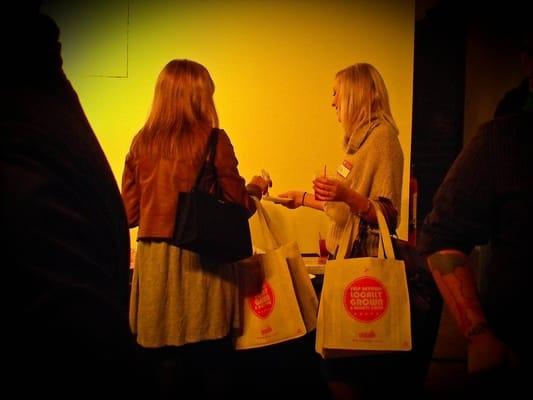 Getting a bag of goodies from the table!