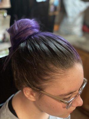 The whole side and underneath of her hair is grey... 