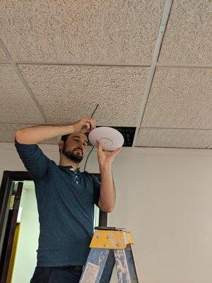 Lead Technician Jami installing a new access point