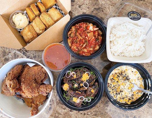 L to R: Whole Fried Chicken ($25), Galbi (1 lb-$16), Cheese Corn ($4), Kimchi ($4). Rice, biscuits & cornbread were comped.