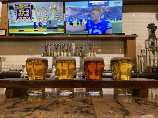 A flight of four beers.