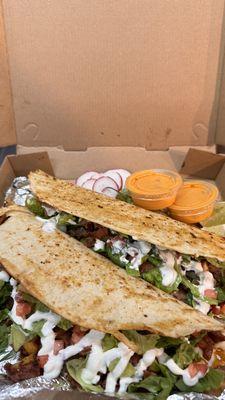 MACHETES
Two big Handmade corn tortilla folded in half With,melted mexican cheese,lettuce,tomatoes, sour cream, guacamole and your choice