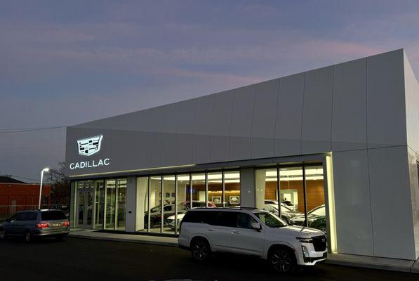 Beautiful lit sign at night at Atlantic Cadillac