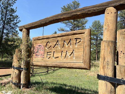 Camp Elim sign near entrance