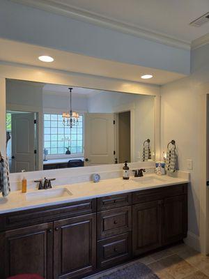 We removed our client's jacuzzi tub and installed a makeup vanity & replaced the vanity with double sinks with matching countertops