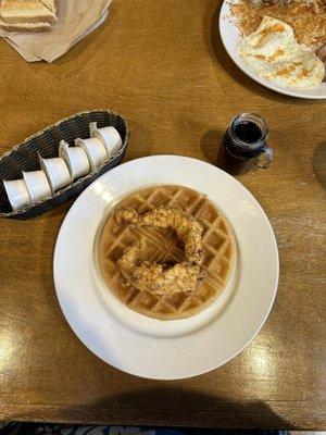 Chicken and waffles. Note the tiny mason jar with syrup