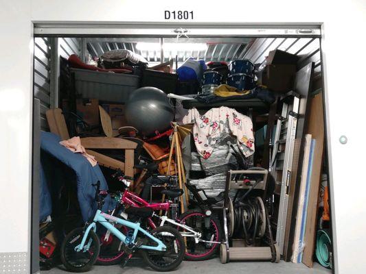 Manager sent them back to "fix" the problem. I came back to this. Organized, but still loose items & TV on floor. $1500 drumset up there