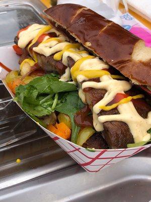 Beyond sausage, Morningstar bacon, greens, grilled peppers, portobello mushroom and fabulous sauces on a pretzel bun.