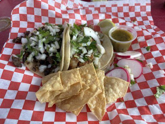 Carne asada taco, carnitas taco, chips. Love the green salsa.