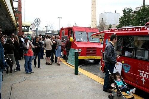 People eating and in line for food