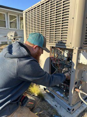 Justin working on a customer's HVAC system.
