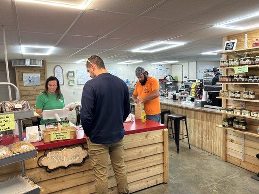 Dawn manning the front with customers.