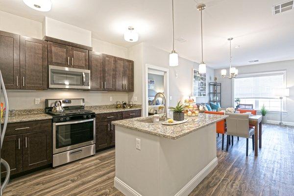 Our kitchens are styled with granite, stainless steel appliances, and slow close drawers.
