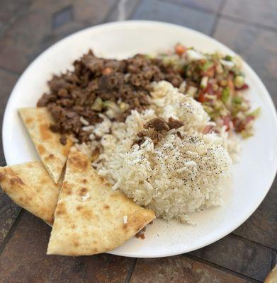 Lamb shawarma with rice, salad and pita bread