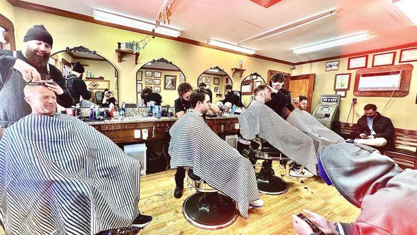 Classic packed house barber shop.