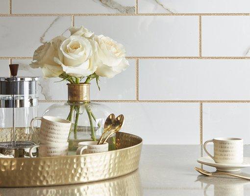Gold grouted white marble look tile! Come see what we can do to make your space unique. http://www.shopbriansflooring.com/reviews