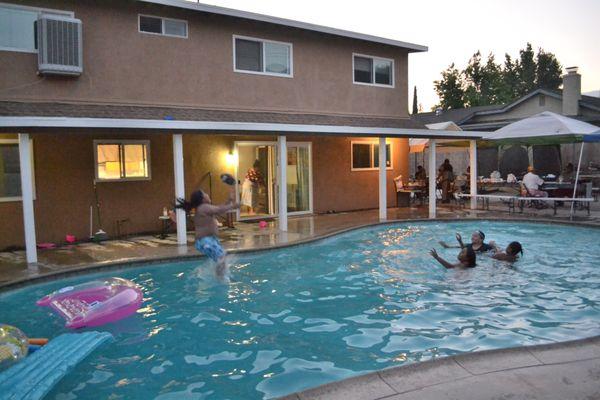 Enjoying our pool in the backyard.