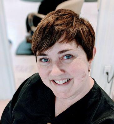 Modern pixie crop with rich brunette tones and lived-in texture. Fresh + fierce