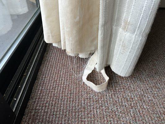 Curtains at deck door ripped/dirty w red spots