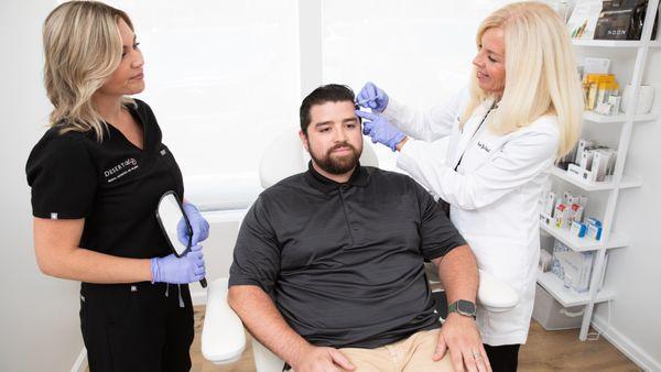 Patient receiving treatment at Desert Glow Medical Aesthetics and Wellness.