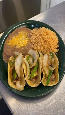 Pork belly fajita tacos with beans and rice