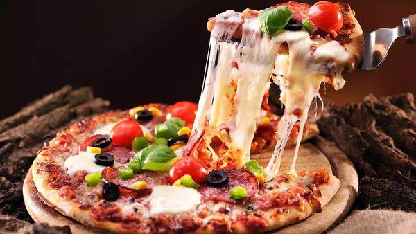 Masala Slice: Authentic Indian-Style Pizza combining bold spices and fresh ingredients. Enjoy a unique fusion of Indian flavors on a perfect